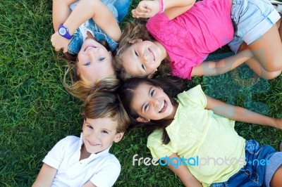 Group Of Childrens Having Fun In The Park Stock Photo