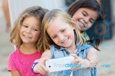 Group Of Childrens Taking A Selfie In The Park Stock Photo