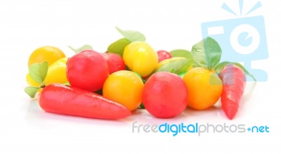 Group Of Deletable Imitation Fruits On White Floor Stock Photo