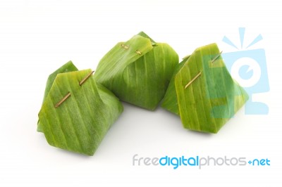 Group Of Dessert Banana Leaf Package With Bamboo Stick On White Stock Photo