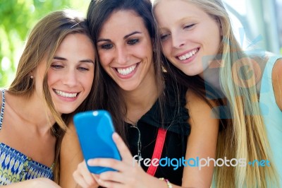 Group Of Friends Having Fun With Smartphones Stock Photo