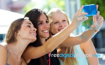 Group Of Friends Taking Selfie In The Street Stock Photo