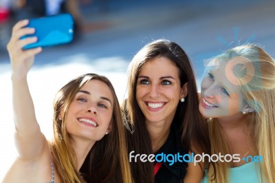 Group Of Friends Taking Selfie In The Street Stock Photo