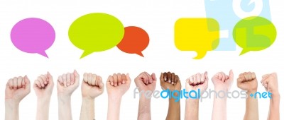 Group Of Hands With Colorful Speech Bubbles Stock Photo