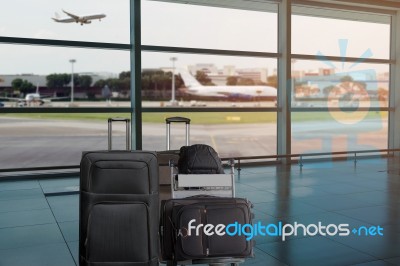 Group Of Luggage In The Airport Terminal Stock Photo