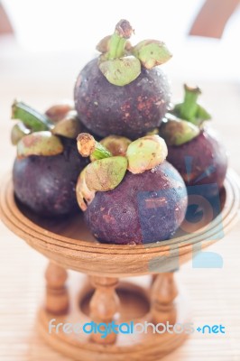 Group Of Mangoesteen On Wooden Tray Stock Photo