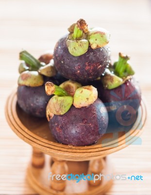 Group Of Mangoesteen On Wooden Tray Stock Photo