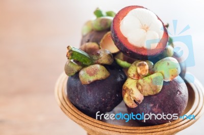 Group Of Mangoesteen On Wooden Tray Stock Photo