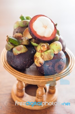 Group Of Mangoesteen On Wooden Tray Stock Photo