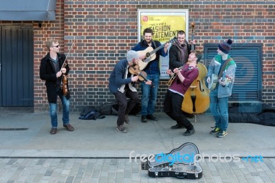 Group Of Men Busking On The Southbank Stock Photo