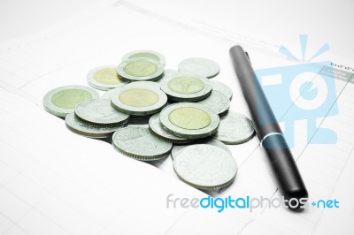 Group Of Thai Baht Coins On The Note Book Stock Photo