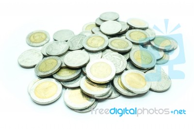 Group Of Thai Baht Coins On White Table Background Stock Photo