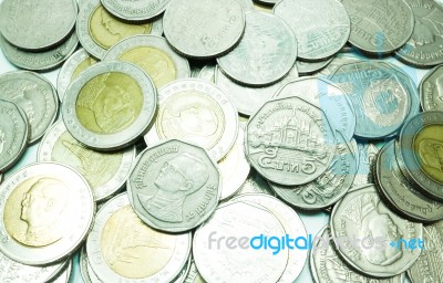 Group Of Thai Baht Coins On White Table Background Stock Photo