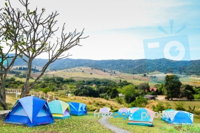 Group Of Tourist Tent On The Hills Stock Photo