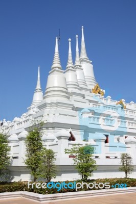 Group Of White Pagoda On Church On Blue Sky Stock Photo