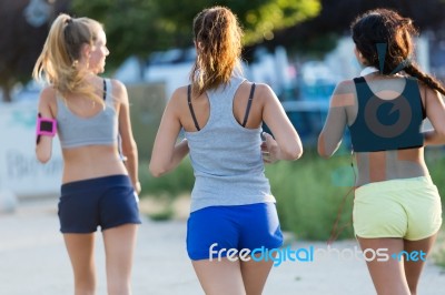 Group Of Women Running In The Park Stock Photo