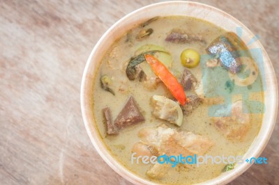 Grren Curry In Wooden Bowl Stock Photo