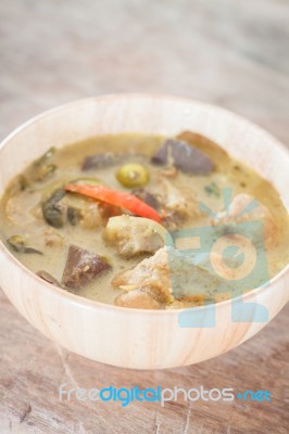 Grren Curry In Wooden Bowl Stock Photo