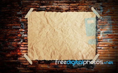 Grunge Paper On Brick Wall Stock Image