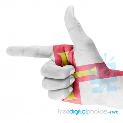 Guernsey Flag On Shooting Hand Stock Photo