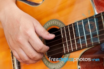 Guitar And Hand Stock Photo