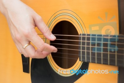 Guitarist Hand Playing Acoustic Guitar Stock Photo