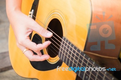 Guitarist Hand Playing Acoustic Guitar Stock Photo