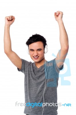 Guy Enjoying Music Isolated Over White Stock Photo