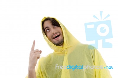 Guy In Waterproof Coat Pointing At Rain Stock Photo