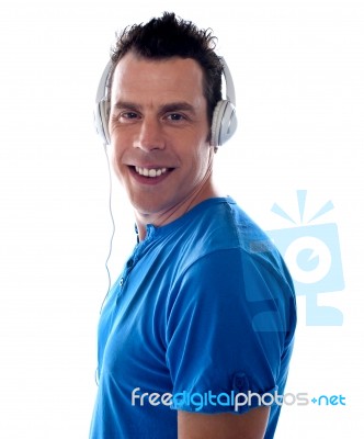 Guy Listening Music With Headphone Stock Photo