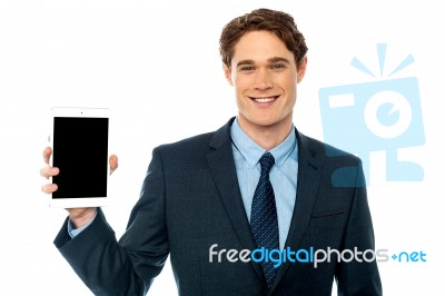 Guy Presenting Newly Launched Tablet Device Stock Photo