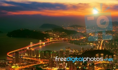 Gwangan Bridge And Haeundae At Sunset In Busan,korea Stock Photo