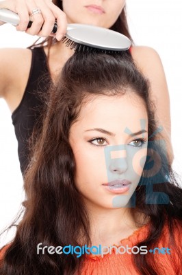 Hairdresser Combing Customer's Hair Stock Photo