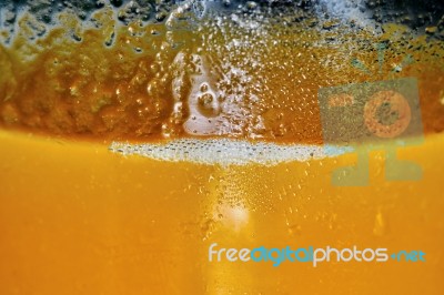 Half A Glass Of Peach Juice Stock Photo