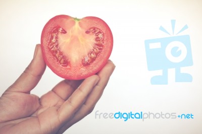 Half Cut Of Red Potato In Human Hand Stock Photo