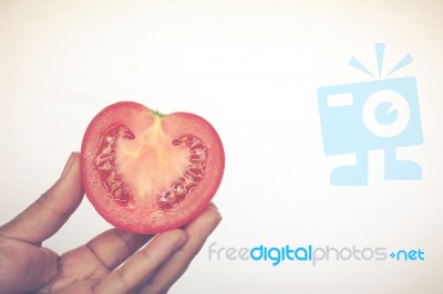 Half Cut Of Red Potato In Human Hand Stock Photo