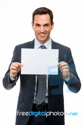 Half Length Portrait Of A Smiling Businessman Holding A Blank Pa… Stock Photo