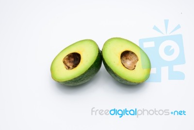 Half Of Green Avocados Isolated On A White Background Stock Photo