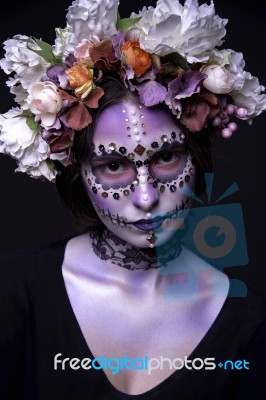 Halloween Girl With Rhinestones And Wreath Of Flowers Stock Photo