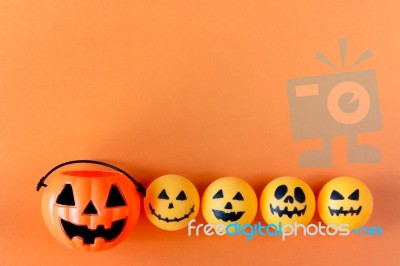 Halloween Jack O Lantern Bucket On Orange Background, Halloween Stock Photo