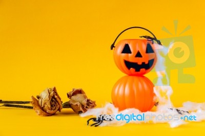 Halloween Jack O Lantern Bucket With Dried Rose Stock Photo