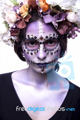 Halloween Model With Rhinestones And Wreath Of Flowers Stock Photo