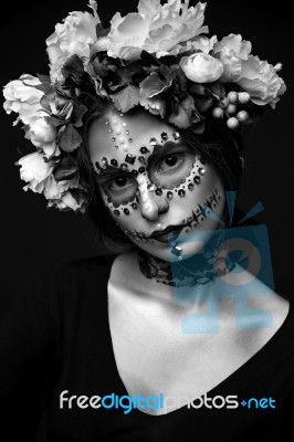 Halloween Model With Rhinestones And Wreath Of Flowers Stock Photo