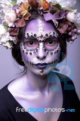 Halloween Model With Rhinestones And Wreath Of Flowers Stock Photo