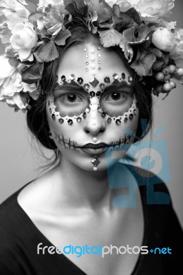 Halloween Model With Rhinestones And Wreath Of Flowers Stock Photo