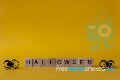 Halloween Wooden Blocks With Spiders On Yellow Background, Hallo… Stock Photo