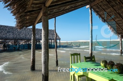 Hammocks And Beach Chairs Under The Shade Of A Palapa Sun Roof U… Stock Photo