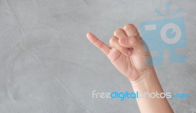 Hand Action Gesture On Grey Background Stock Photo