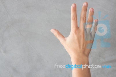 Hand Action Gesture On Grey Background Stock Photo