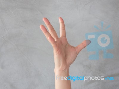 Hand Action Gesture On Grey Background Stock Photo